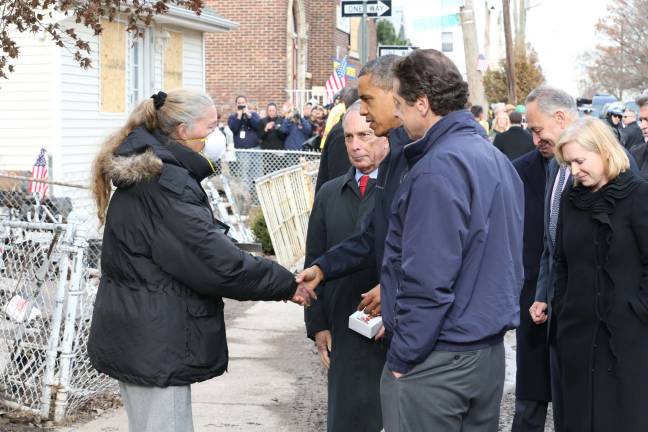City copes with Trump approach to climate change Former President Barack Obama joined then-Mayor Michael Bloomberg to tour some of the sites hardest-hit by Hurricane Sandy in 2012. Photo: Spencer T Tucker/Mayor’s Office of Photography