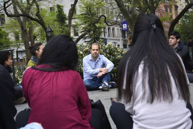 NYU Sanctuary’s May Day walkout Iddo Tavory, an assistant professor of sociology at New York University, in Washington Square Park with his class of about 15 students during a May Day teach-out. Photo: Diamond Naga Siu