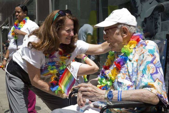 Caring For Caregivers The New Jewish Home CEO Audrey Weiner and resident Richard Morse prepare for NYC Pride March.