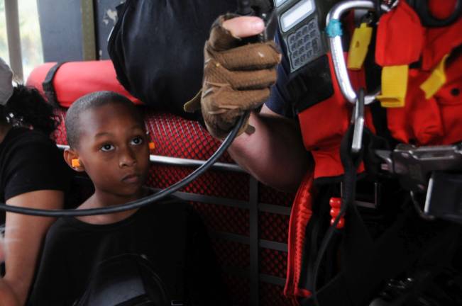 Hurricane harvey: how new yorkers can help A child looks up at Staff Sgt. Ryan R. Dush, with the 103rd Rescue Squadron of the 106th Rescue Wing assigned to the New York Air National Guard, while flying in an HH-60 Pave Hawk helicopter over the Houston area, August 30, 2017. The child was safely dropped off to the Montagne Center in Beaumont, Texas. Photo: Airman 1st Class Daniel H. Farrell, New York National Guard, via flickr