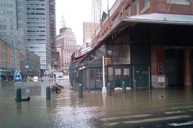 THREATENING OUR CITY’S FUTURE Post-Sandy flooding near South Street Seaport: Photo: NYC Department of Small Business