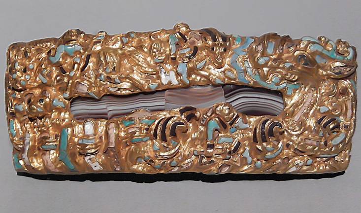 ancient china unearthed An ornamental plaque of agate, surrounded by golden and turquoise animals and dragons, bears witness to cultural influences from afar. Photo: Adel Gorgy
