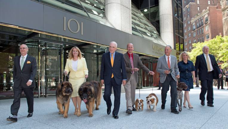 THE DOGS OF PARK AVENUE Developer Peter Kalikow (center left) in front of his building at 101 Park Avenue, which will be the new home of the American Kennel Club and its Museum of the Dog. At far left is AKC President and CEO Dennis Sprung, with AKC executives, dog owners, dog handlers, and of course, dogs. Photo: Nancy Epstein / H.J. Kalikow & Co. LLC