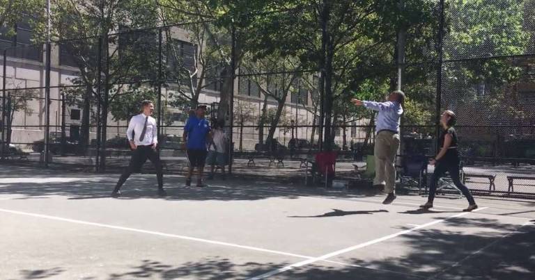 PLAYERS TRY THEIR HAND AT HANDBALL State Senator Brad Hoylman, white shirt, and Parks Department Commissioner Michael Silver, blue shirt at right, have a go on new handball courts in Chelsea Park. Photo: Madeleine Thompson