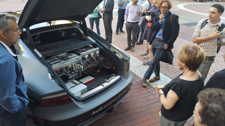 Preparing for automation in NYC A self-driving Audi A7 on display outside the David N. Dinkins Municipal Building in September attracted passers-by, who gazed at the tangle of electrical wires in its trunk. Photo: Micah Danney