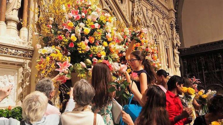 words of wisdom At Trinity Church, the Rev. Dr. William Lupfer invited congregants to take a flower home after the last service of Easter Sunday. Photo: Trinity Church Wall Street/James Melchiorre