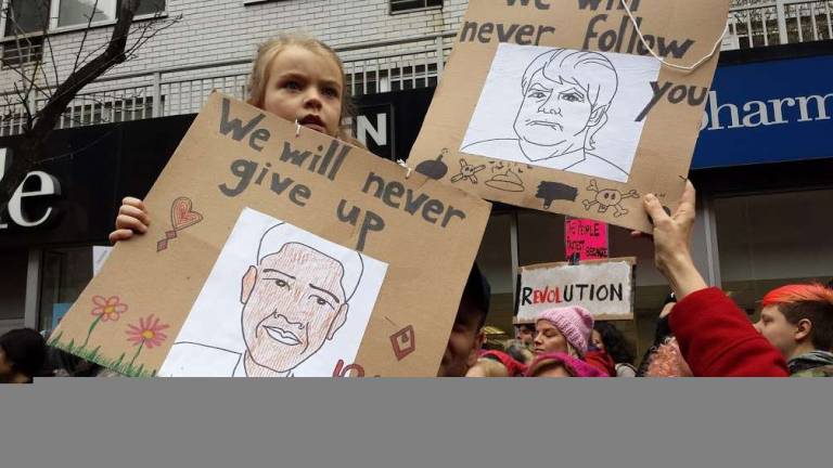 Onward: 400,000 take to the streets A child holds up her sign during Saturday's Women's March in New York. Photo: Charmaine P. Rice