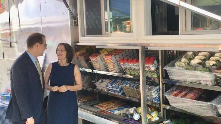 A food pantry on wheels Council Members Helen Rosenthal and Mark Levine check out WSCAH's new mobile pantry, which serves clients at Levine's office in Harlem. Photo: Leslie Gersing