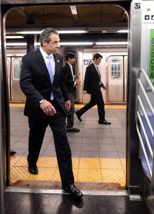 Governor Andrew Cuomo boards an E train at Chambers Street for the ride to Penn Station in September 2014. Photo: Marc A. Hermann / MTA, via Wikimedia Commons &#xa0;