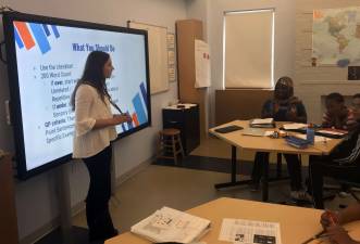 Laura Habian, teaching fellow and a junior at Vanderbilt University, teaches eighth grade writing at Breakthrough New York. Photo: Christina Cardona&#xa0;