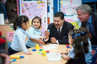Barely three weeks into his new post, the city's schools chancellor, Richard A. Carranza, center, thrust himself into a contentious debate about school diversity taking place within the Upper West Side. Photo: Ed Reed/Mayoral Photography Office