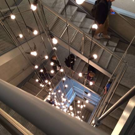 The stairwell at the center of the building takes visitors between floors.