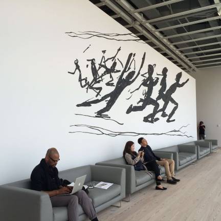 Jonathan Borofsky’s “Running People at 2,616,216” in the western portion of the museum.