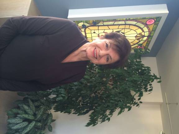 Cleo Dana at her apartment on West 61st Street, where she has a prime view of Damrosch Park from her balcony.