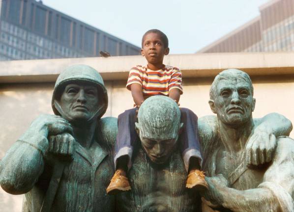 "Boy on Coast Guard Memorial," Battery Park, 1978. D. Gorton, NYC Parks Photo Archive
