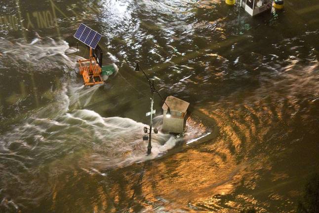 Floodwaters surged into the Manhattan entrance to the Hugh L. Carey Tunnel during Hurricane Sandy in 2012. Future storm events were frequent topics at the Waterfront Alliance's Waterfront Conference last week. Photo: Jay Fine, via Wikimedia Commons.