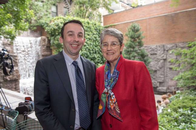 City Council Member Keith Powers and Gail Caulkins, president of the Greenacre Foundation, stand in front of the 25-foot waterfall that dominates Greenacre Park. The East 51st Street oasis was just added to the National Register of Historic Places. Photo courtesy of Greenacre Foundation / Howard Jay Heyman