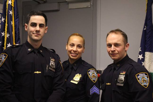Officer Jack Etter, left, Sgt. Rosa Espinal and Officer Edward Groger of the Upper West Side's 20th Precinct. The two officers helped pull a man from the Hudson River's frigid waters on Dec. 24. Photo: Rui Miao