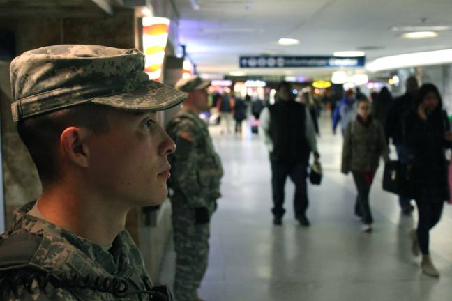 New York National Guard members of Joint Task Force Empire Shield help provide security support at New York City's Pennsylvania Station AMTRAK platforms Nov. 24. The New York National Guards Joint Task Force Empire Shield regularly employs forces in support of city, state and federal law enforcement agencies across New York City. November 25th is considered the busiest travel day of the year as families gather for the Thanksgiving holiday. Photo by Spc. Napoleon Valazquez, Joint Task Force Empire Shield.