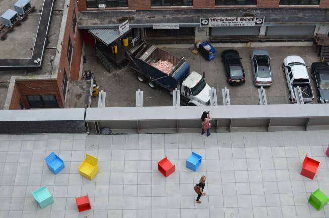A terrace overlooks Mary Heilmann’s installation, as well as Weichsel Beef purveyors, one of the remaining meatpacking plants.