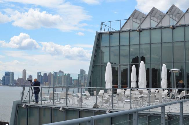 Outdoor terraces, all connected by an exterior staircase, are some of the building’s signature features.