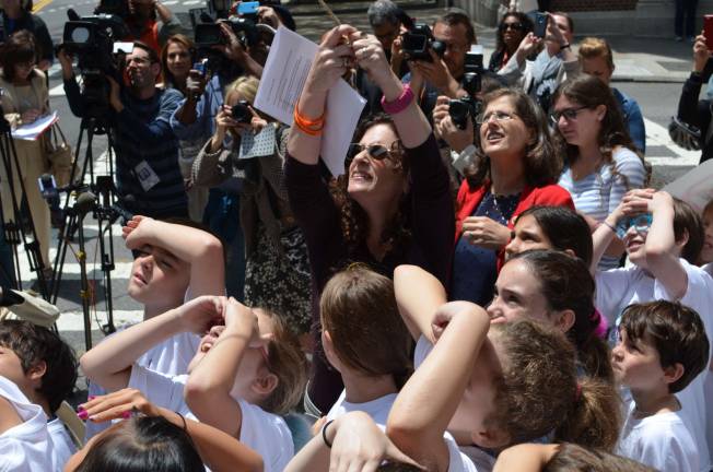 Dana Lerner moves to unveil Cooper Stock Way at the corner of 97th Street and West End Avenue, where her son was killed last year by a reckless cab driver. Photo by Daniel Fitzsimmons.